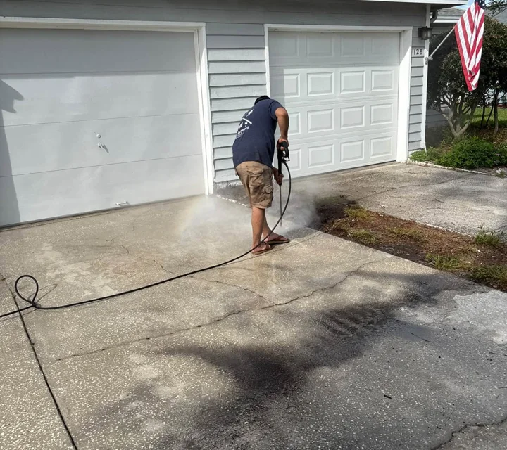 B&E pressure washing a residential driveway