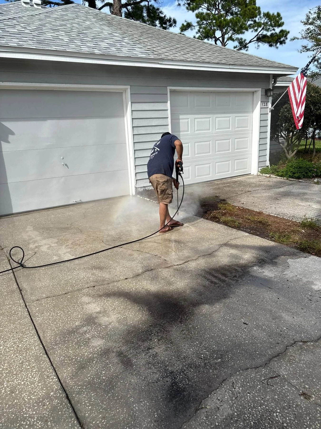 B&E pressure washing a residential driveway